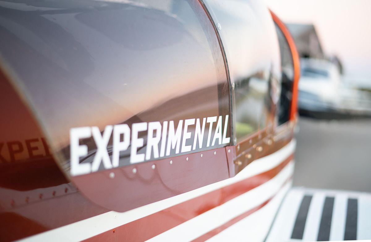 Owner-pilot using a torque wrench on aircraft spark plug during preventive maintenance