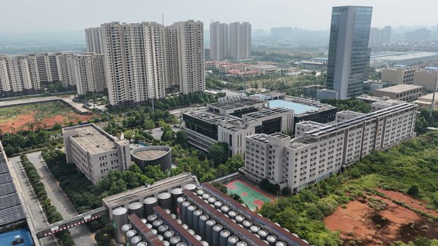 Aerial view showcasing urban architecture and greenery in Changsha, China.