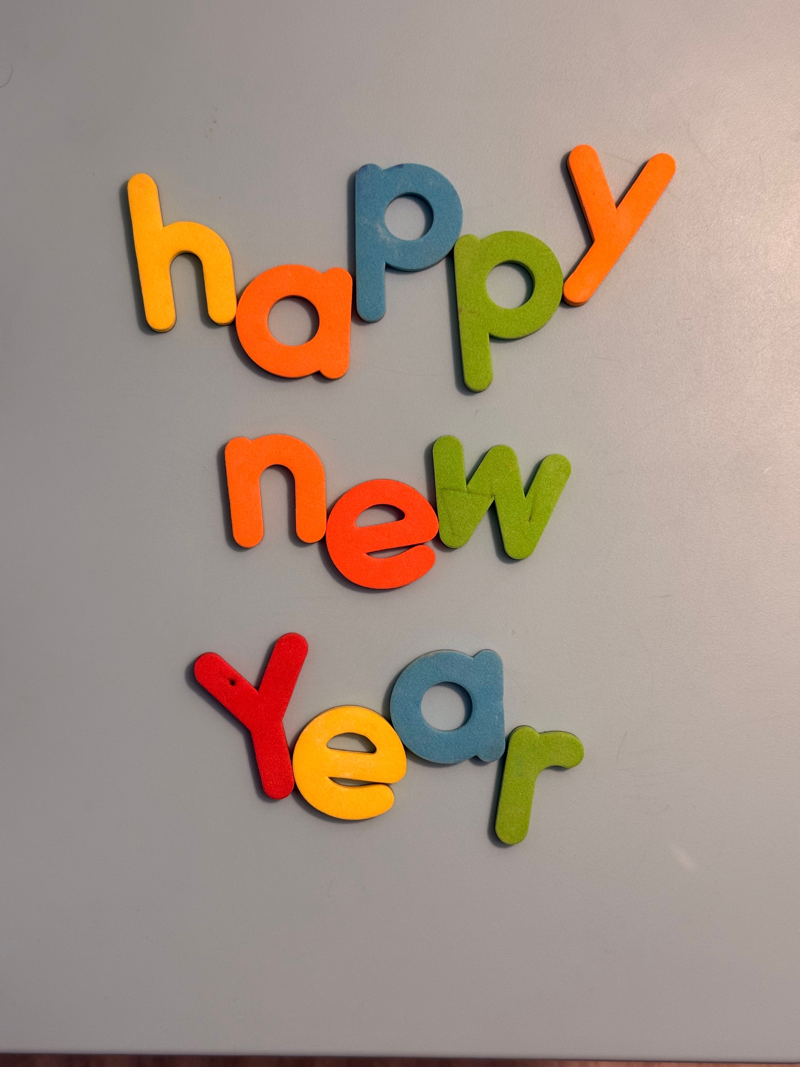 Bright wooden letters arranged to celebrate New Year.