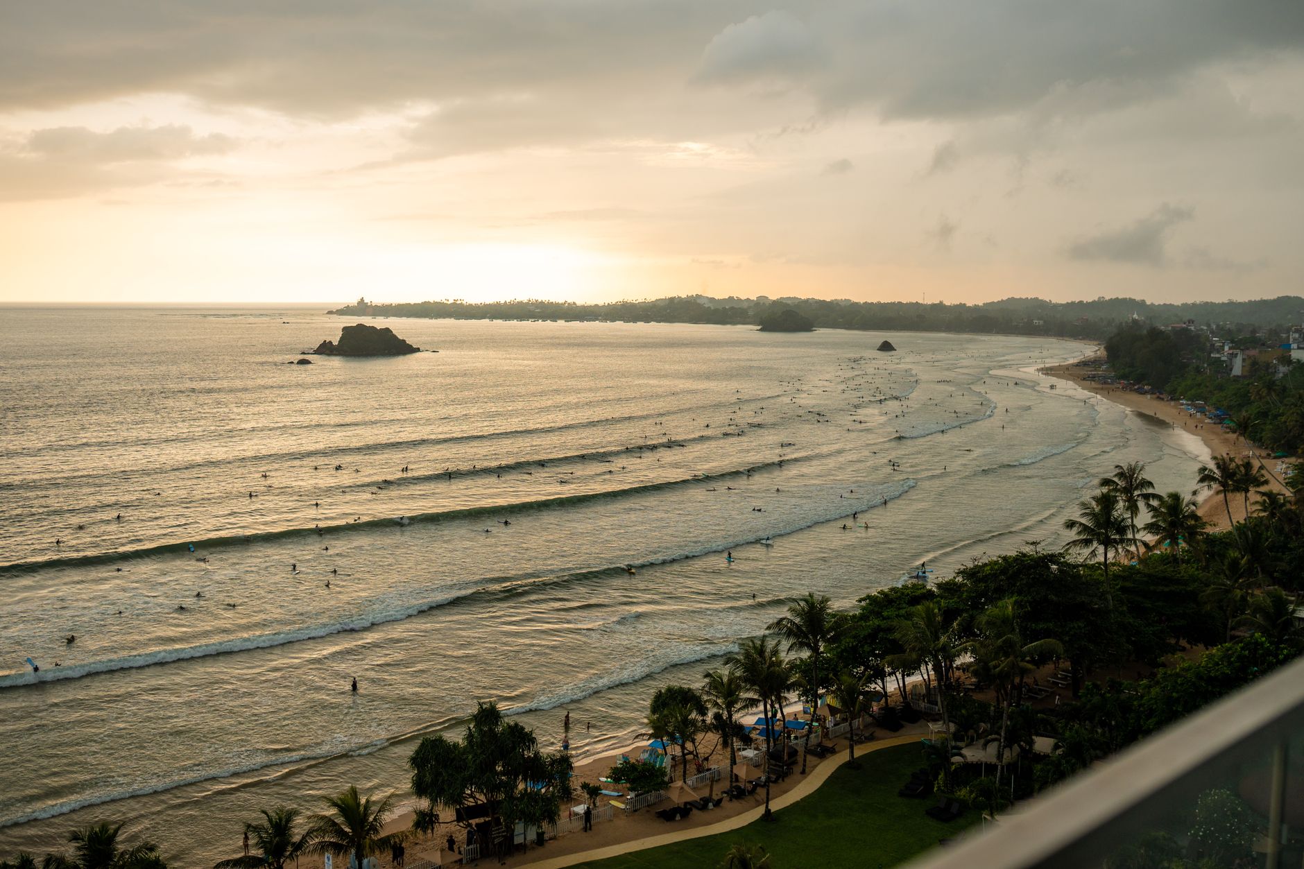 Capture the serene beauty of sunset surfing at Weligama Beach, Sri Lanka's surf paradise.