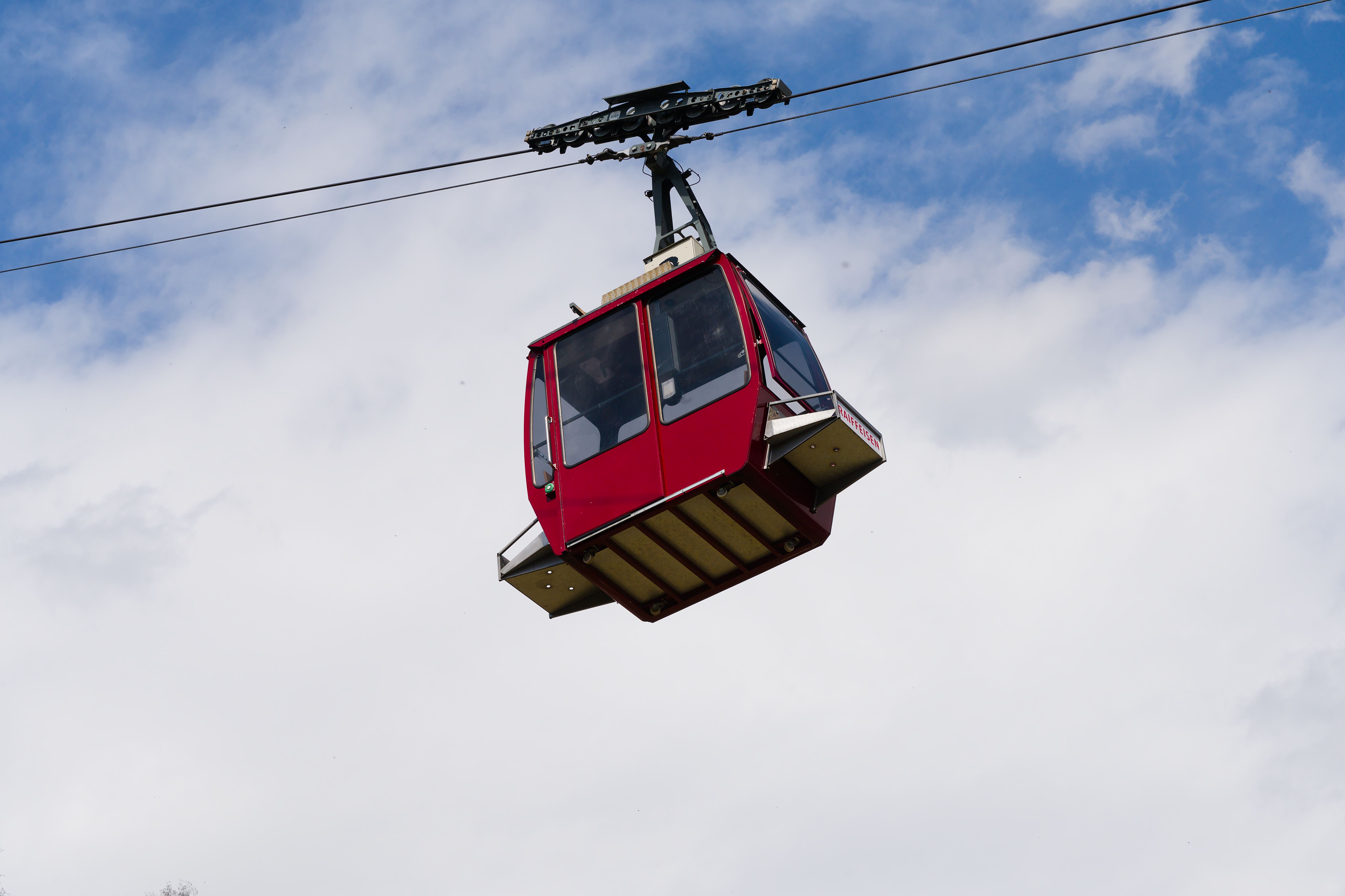 Red Cable Car Against Blue Sky in Swiss Alps · Free Stock Photo