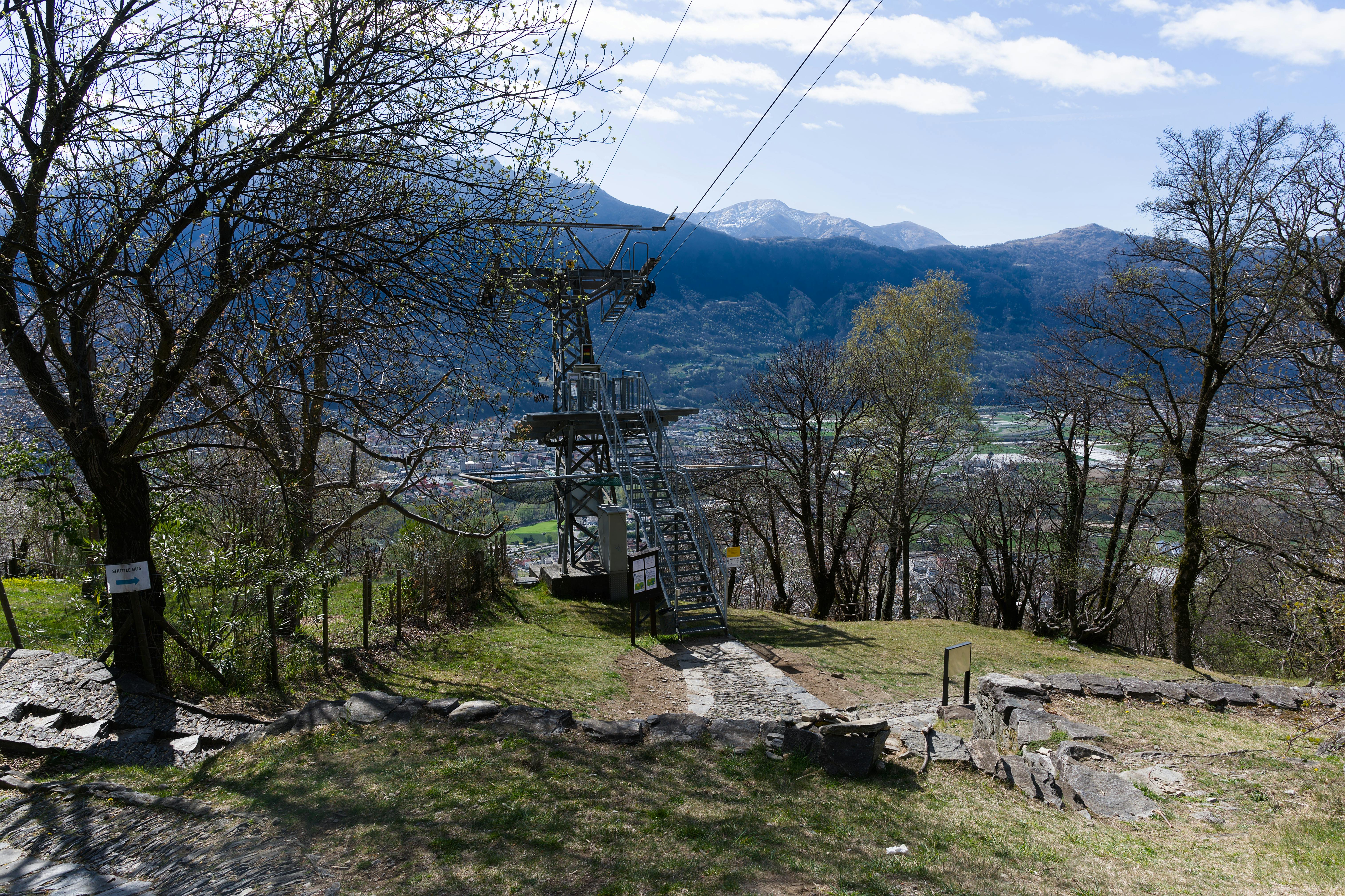 Idyllic view of Swiss mountains with a cable car structure amidst serene nature. - Bellinzona