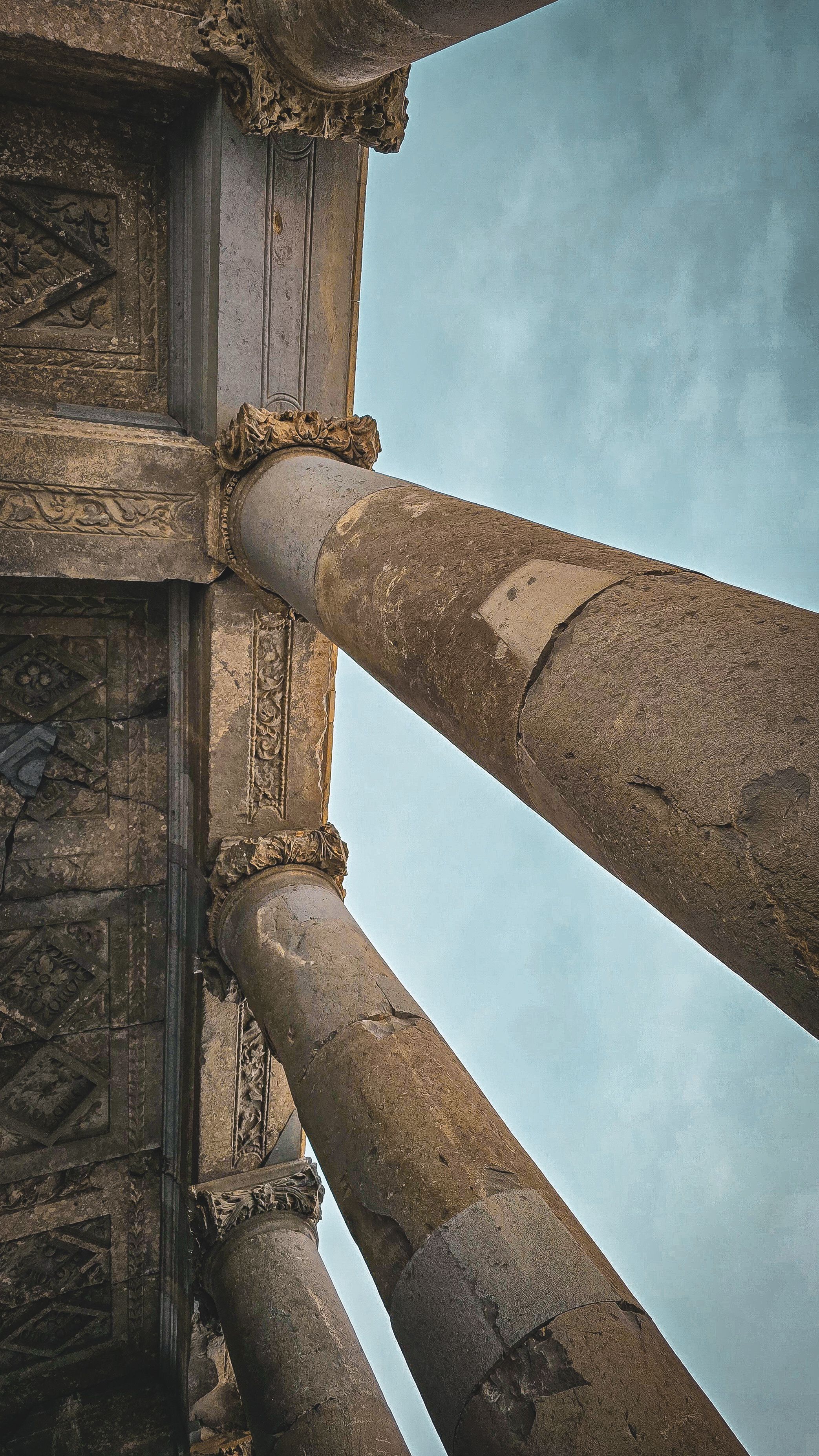 Ancient Stone Columns Against Clear Sky · Free Stock Photo