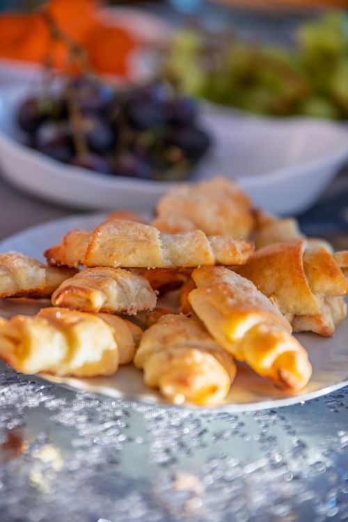 Free A variety of pastries and fresh grapes on a plate, perfect for brunch settings. Stock Photo