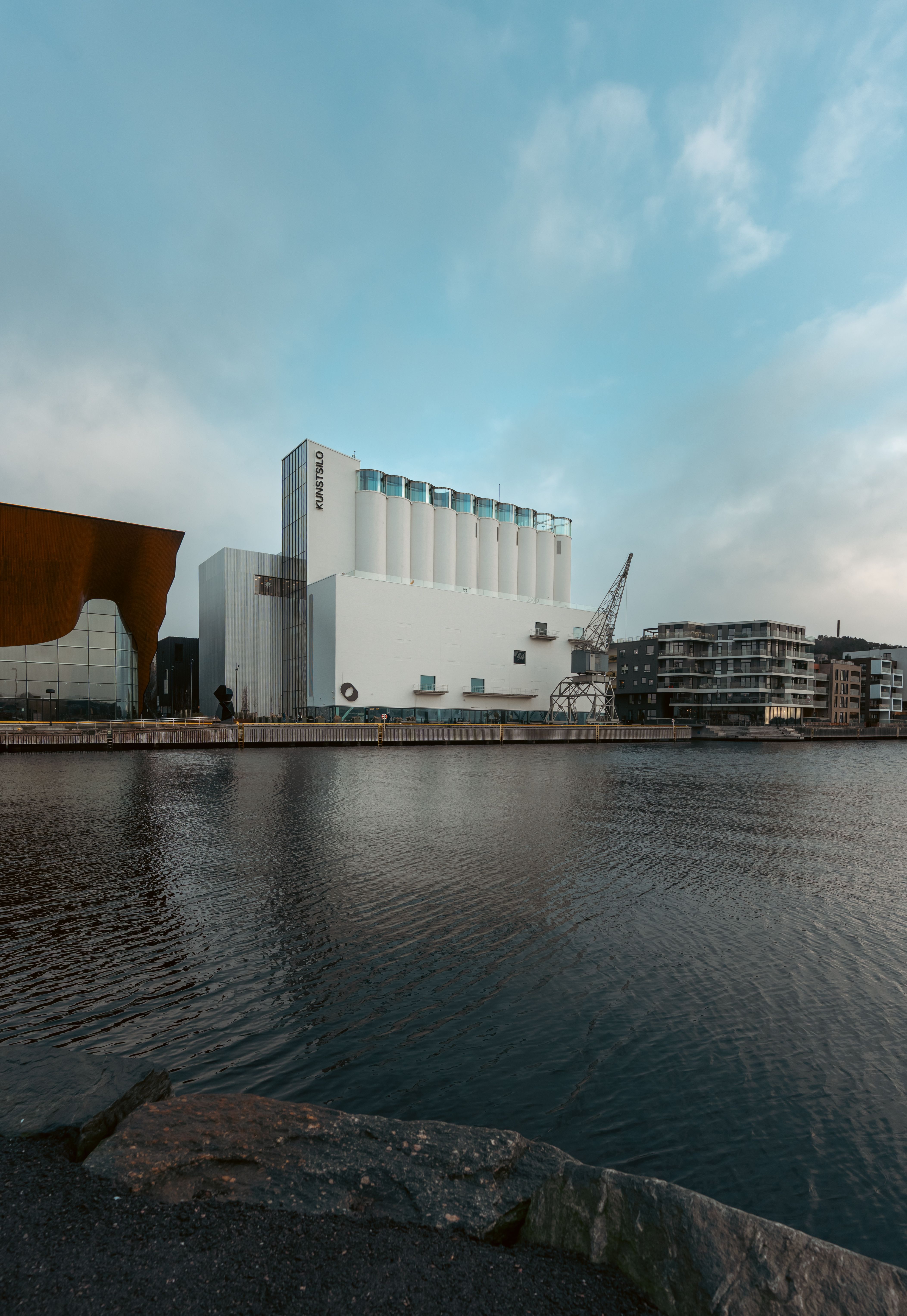 View of Modern Waterfront Industrial Building at Dusk · Free Stock Photo