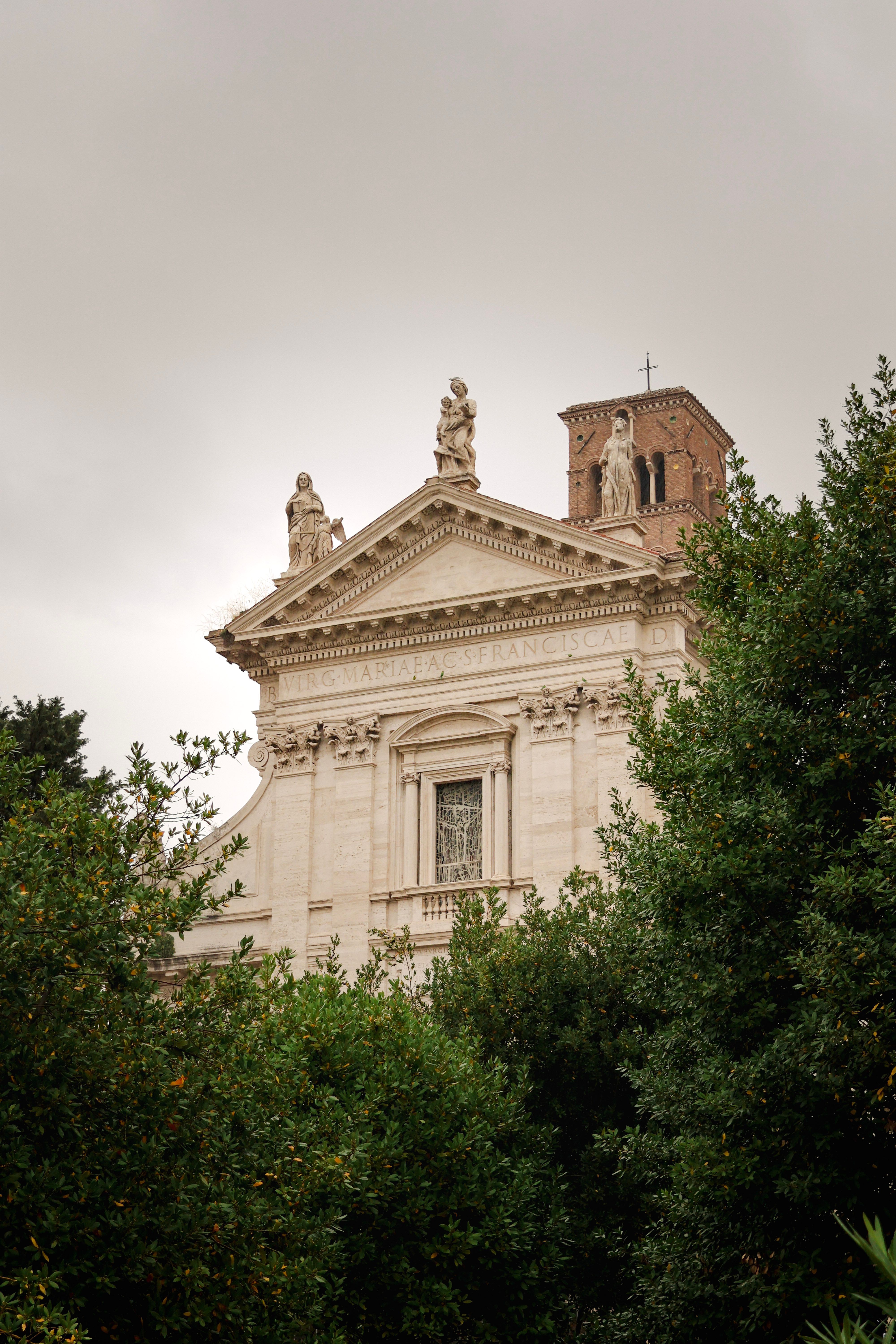 Classic Church Facade in Rome with Greenery · Free Stock Photo