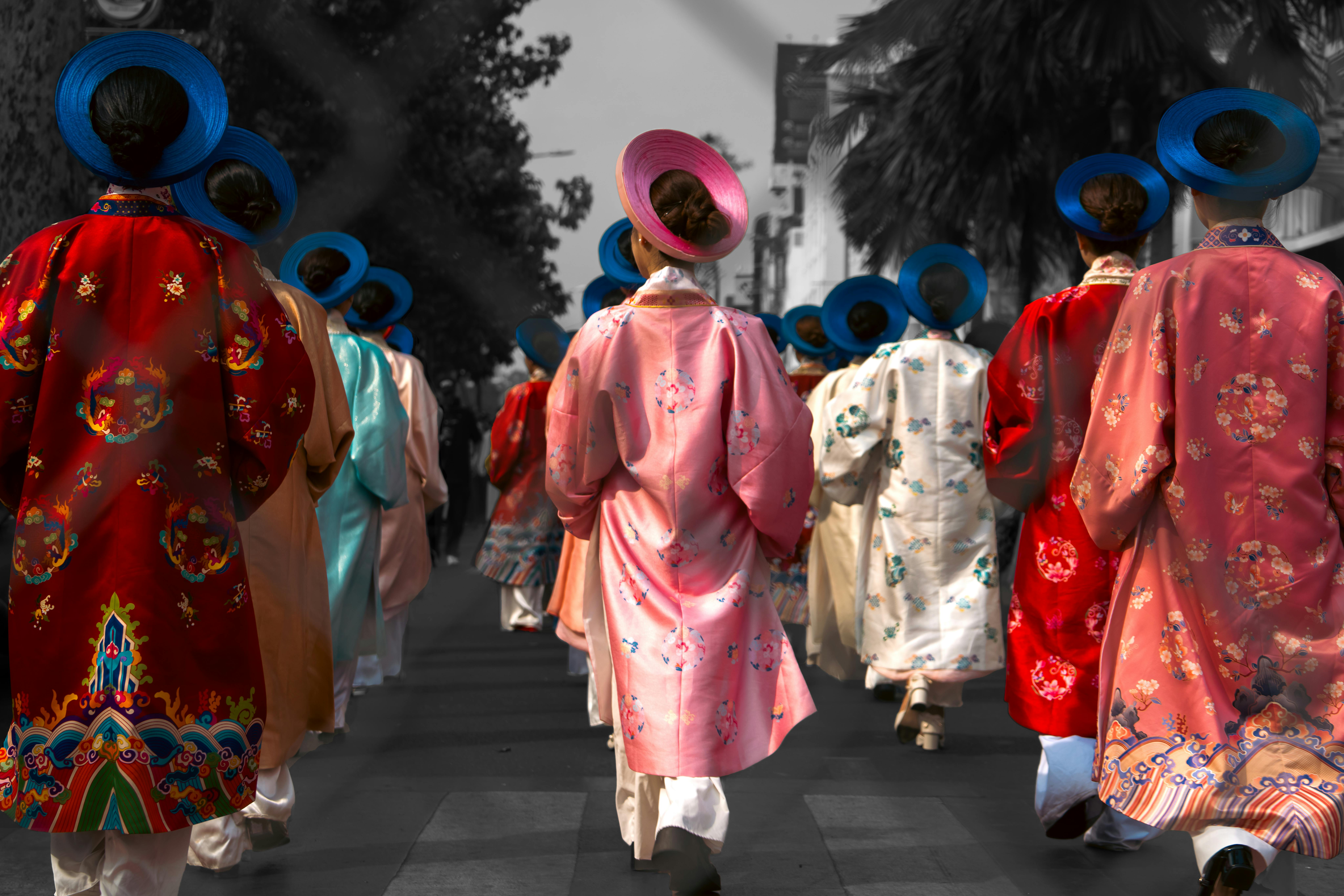 Colorful traditional Vietnamese costumes in a parade, showcasing vibrant culture in Ho Chi Minh City.