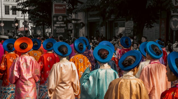 Vibrant traditional Vietnamese costumes parade during New Year in Saigon.