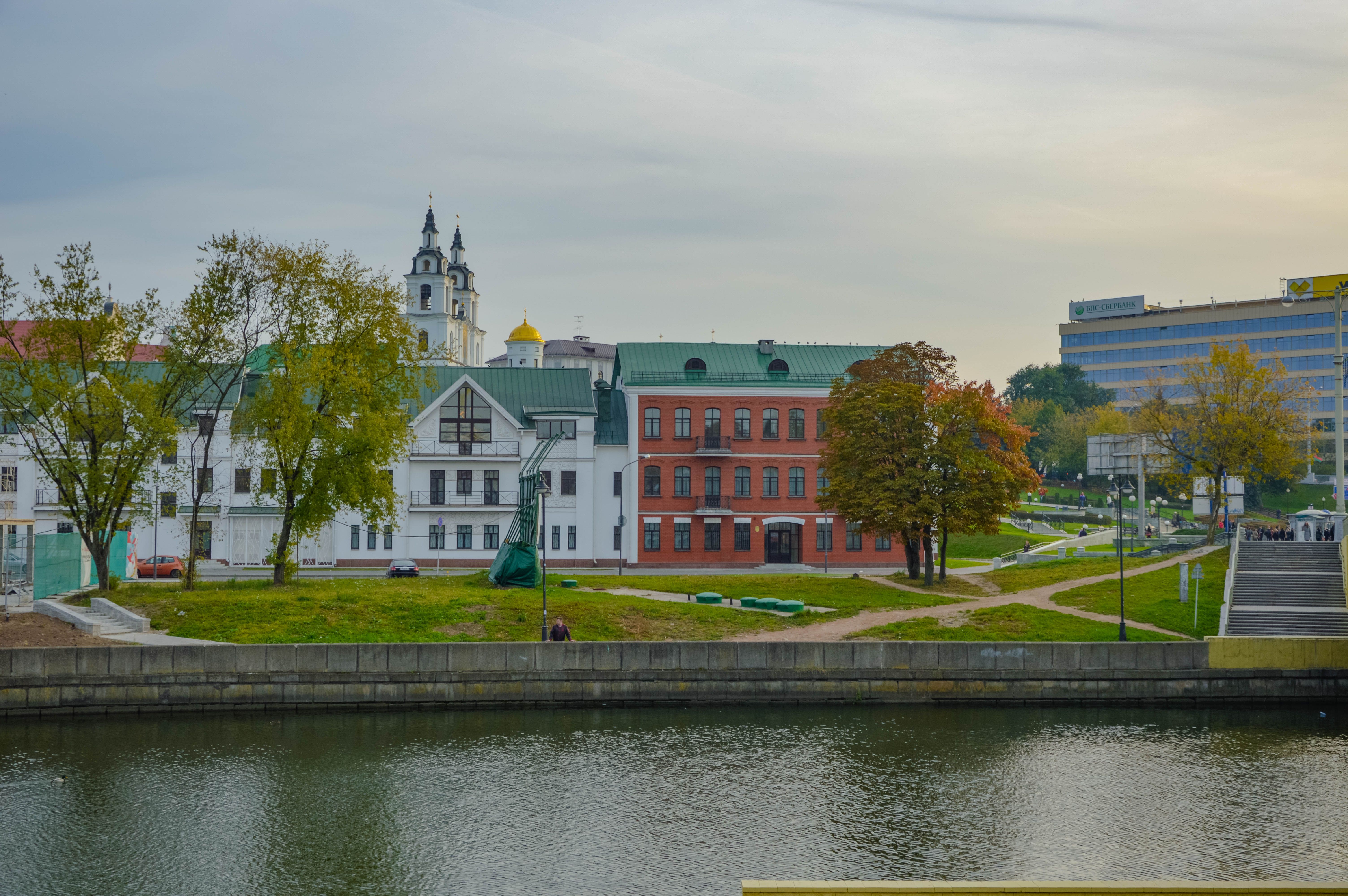 Scenic View of Historic Buildings by a River · Free Stock Photo