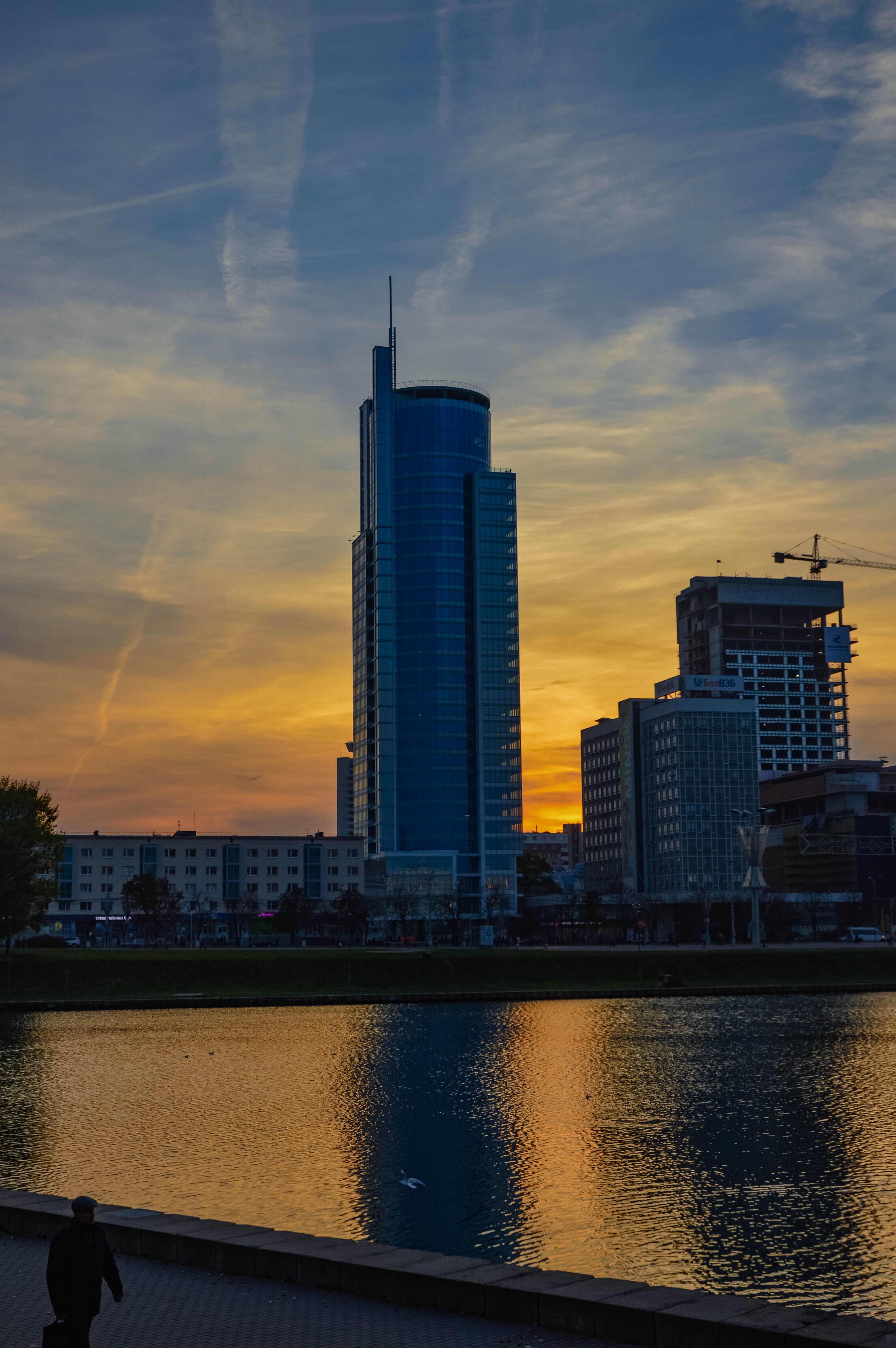 Modern Skyline Against a Vibrant Sunset · Free Stock Photo