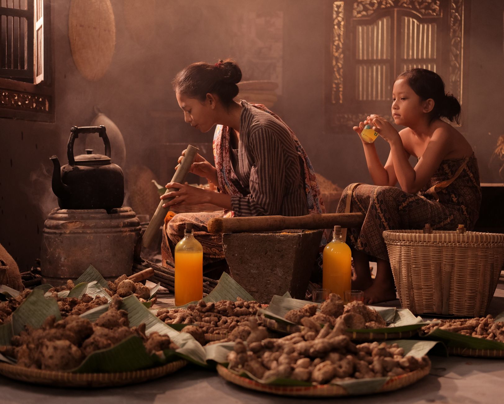 Traditional Malay herbal jamu being prepared with natural ingredients.