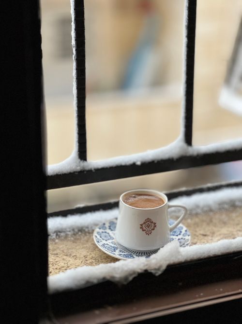 Free A cozy cup of Turkish coffee on a snowy windowsill adds warmth to a winter day. Stock Photo