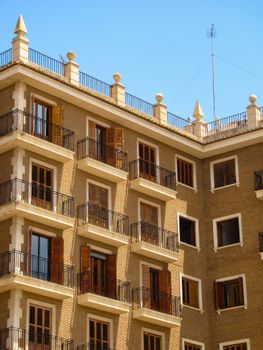 A detailed view of a historic building facade with traditional balconies in Valencia, Spain.