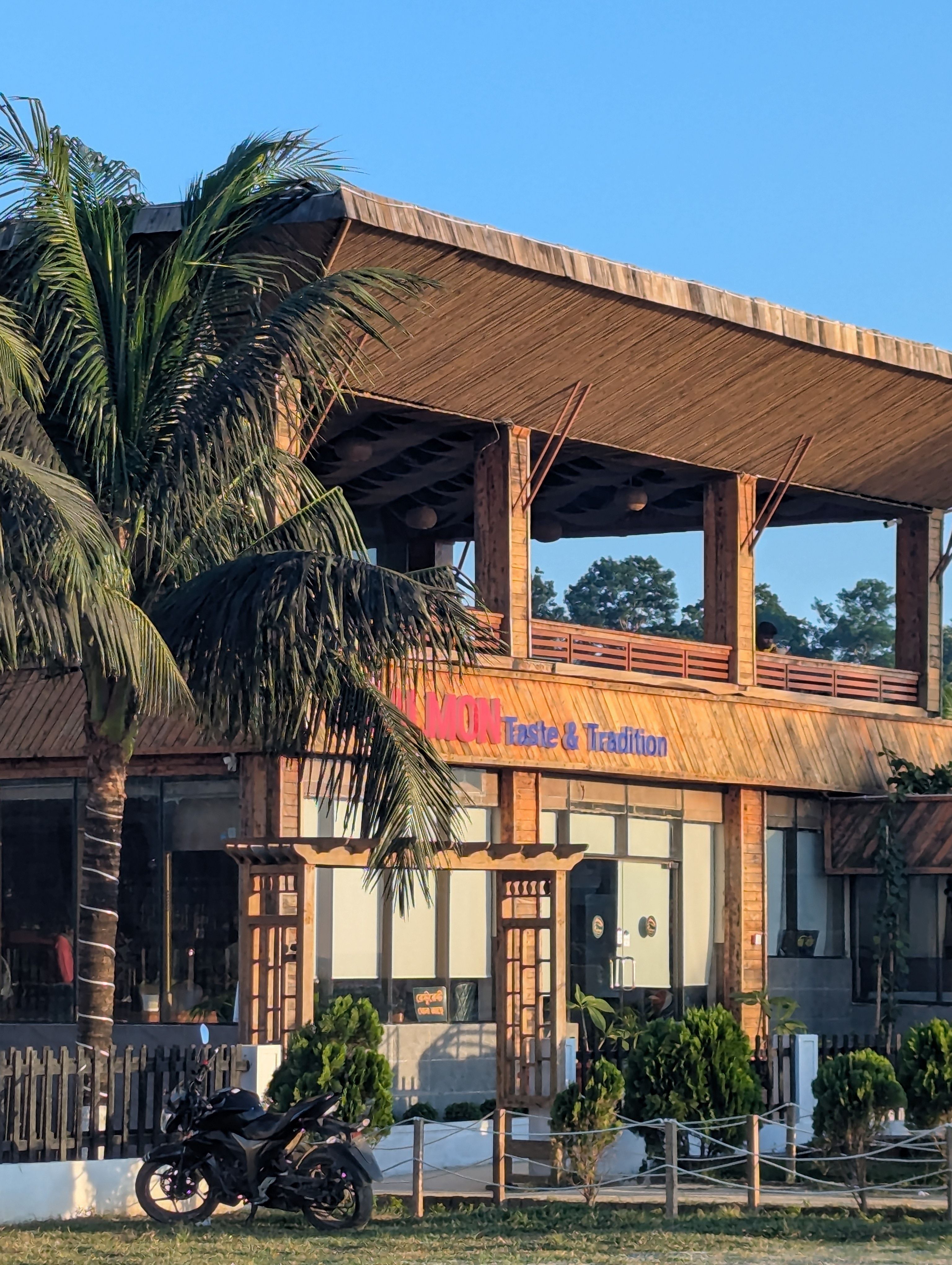 A picturesque bamboo restaurant showcasing rustic architecture in an outdoor setting.