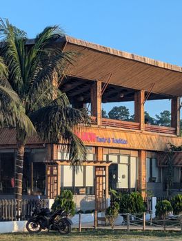 A picturesque bamboo restaurant showcasing rustic architecture in an outdoor setting.
