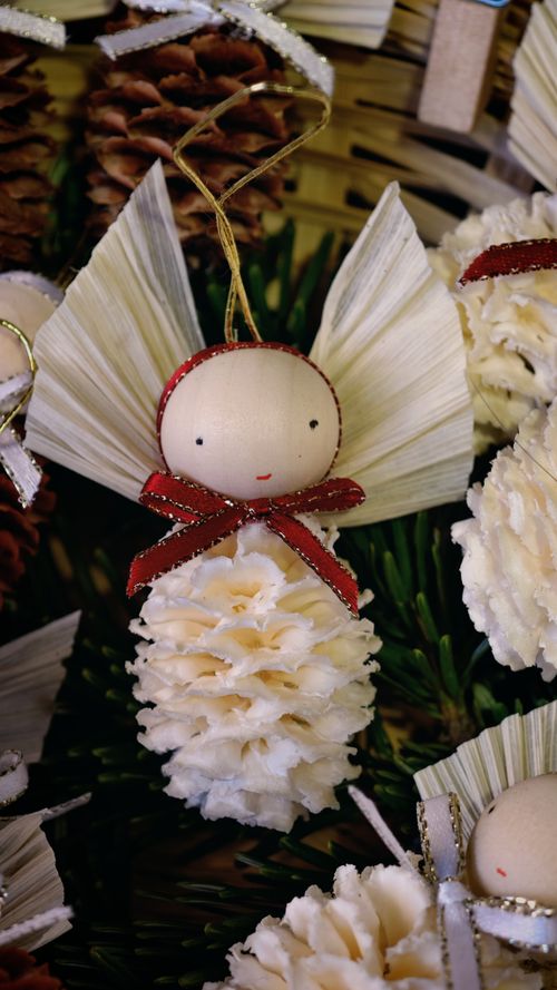 Free Close-up of handmade angel ornaments, perfect for festive Christmas decor. Stock Photo