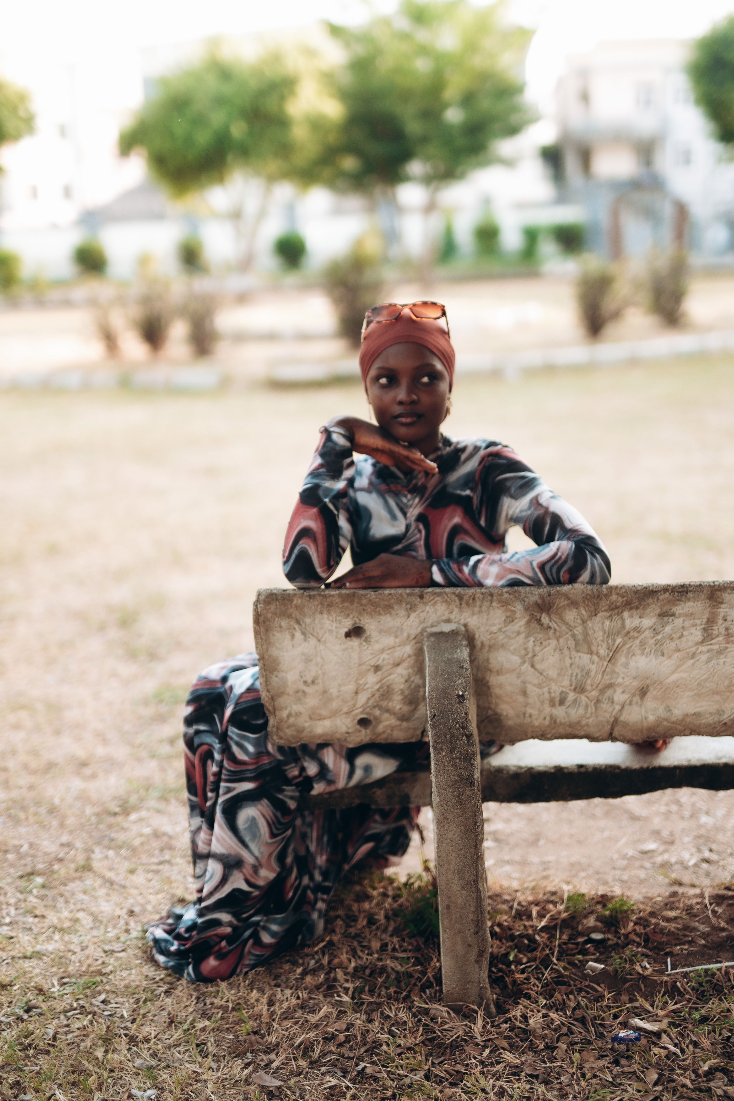 Portrait of a Woman Relaxing on a Park Bench · Free Stock Photo