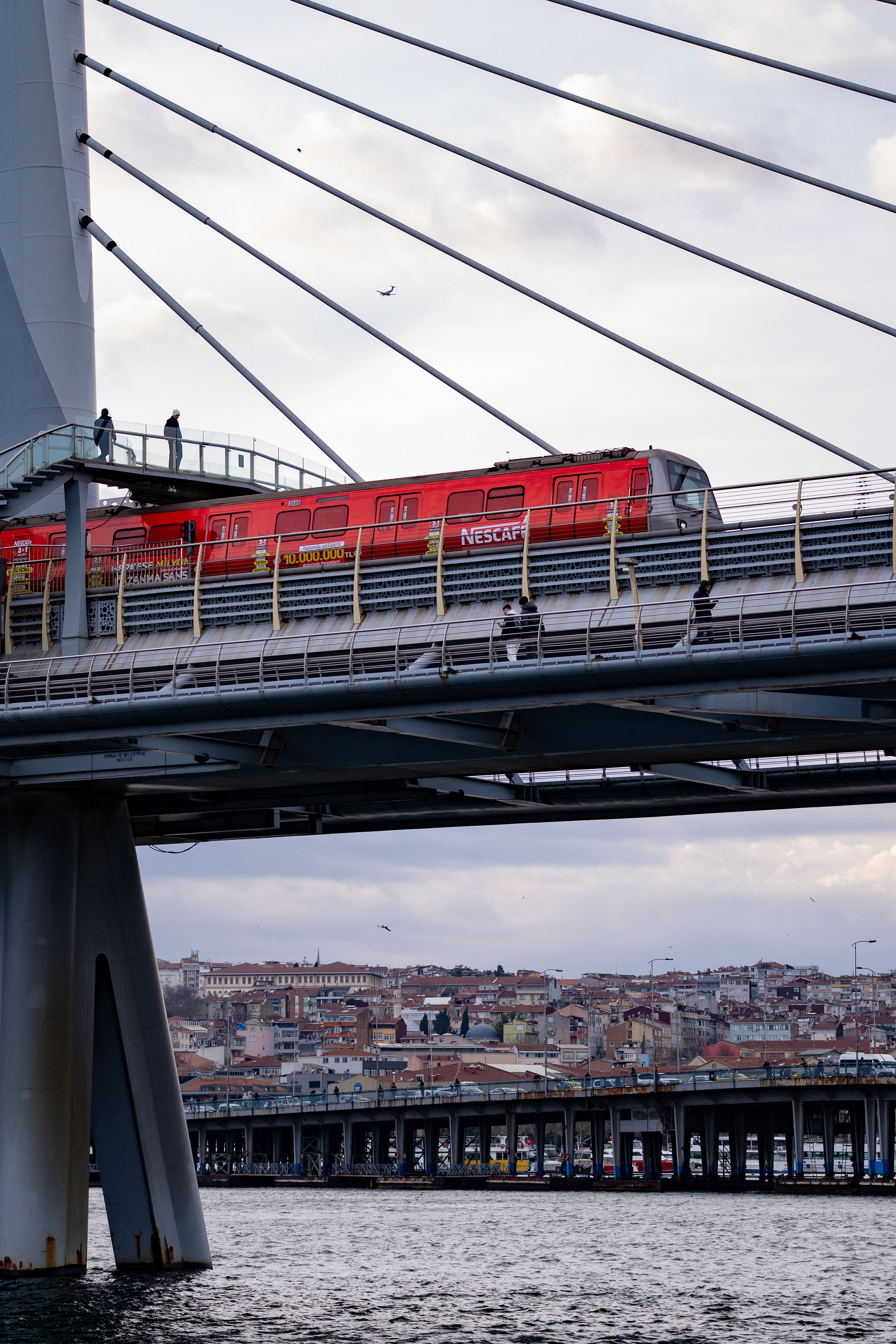 Red Train on Bridge Over Bosphorus in Istanbul · Free Stock Photo