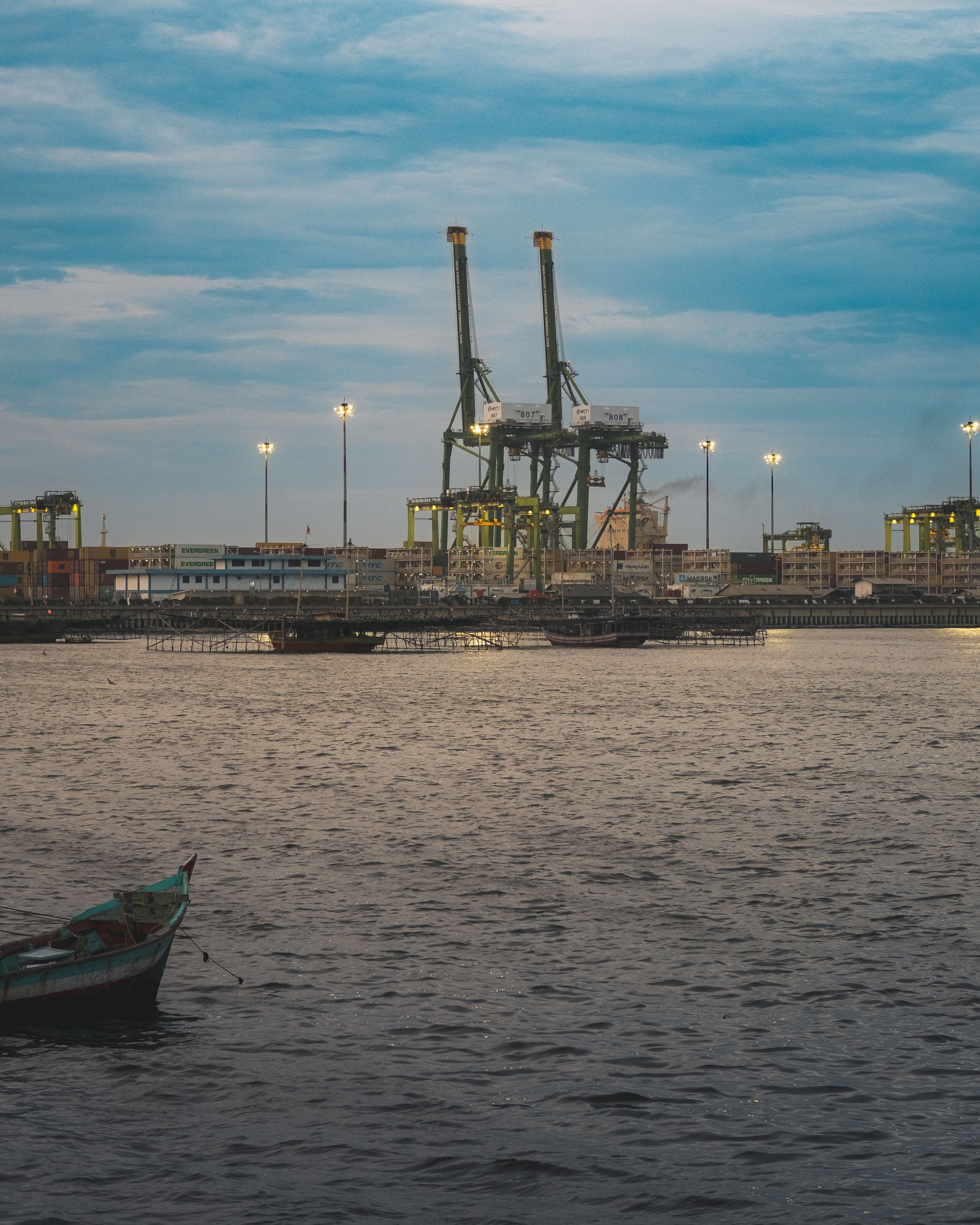 Industrial Port at Dusk with Cargo Cranes · Free Stock Photo