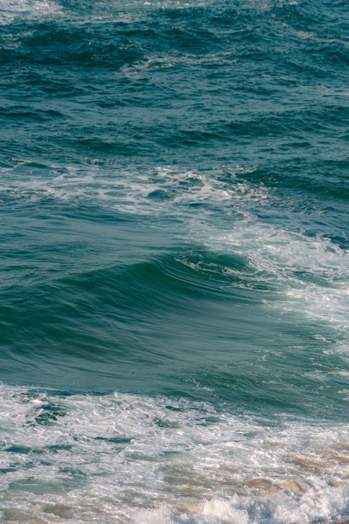 Free Captivating image of ocean waves crashing on the Silveira coast in Portugal. Stock Photo