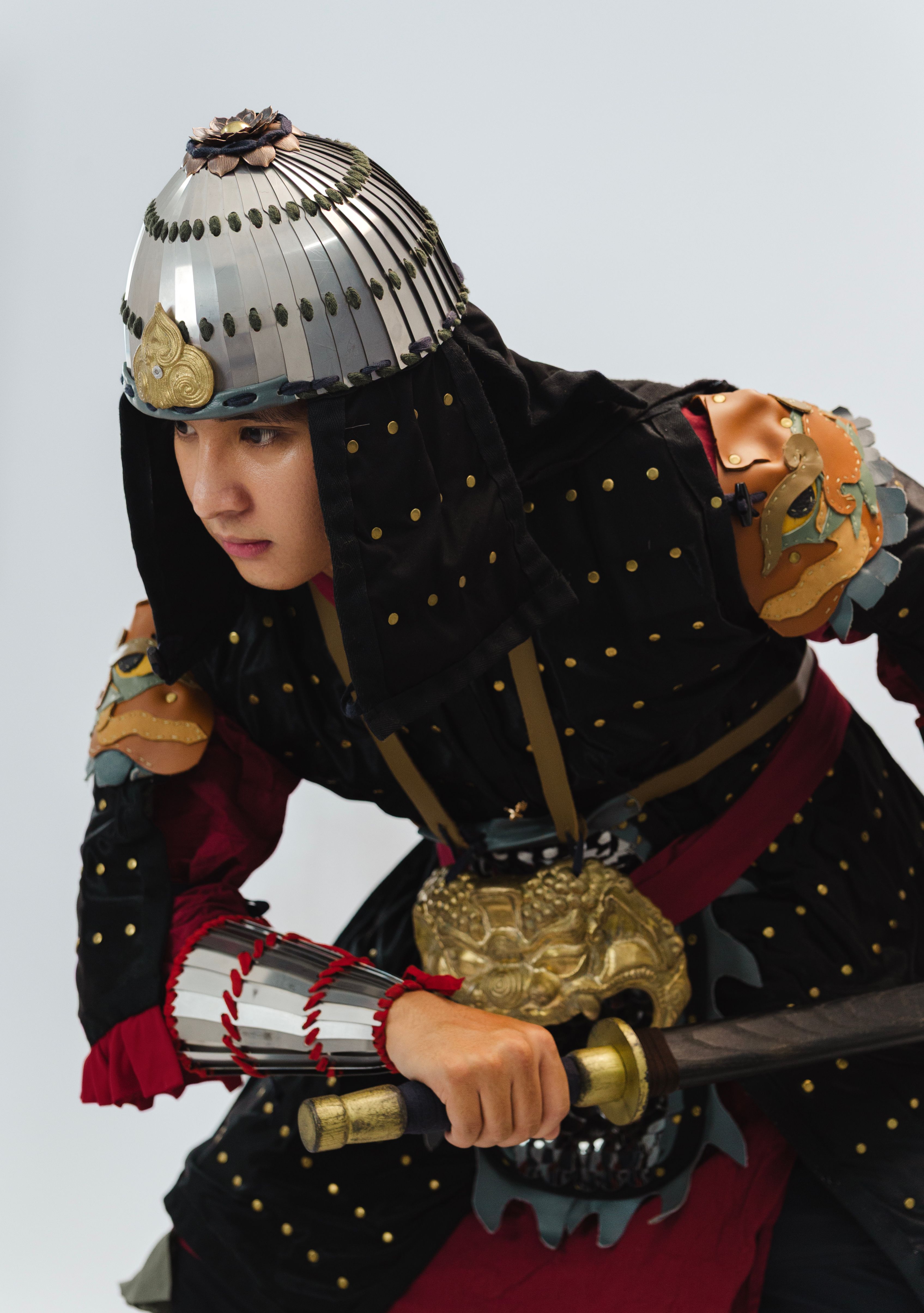 Portrait of a samurai warrior in traditional Japanese armor, ready for battle.