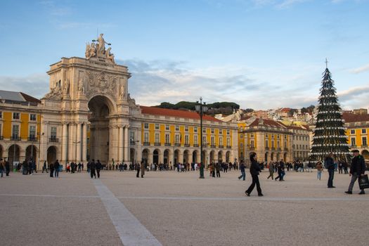 The vibrant Praça do Comércio in Lisbon with Arco da Rua Augusta and a festive Christmas tree.