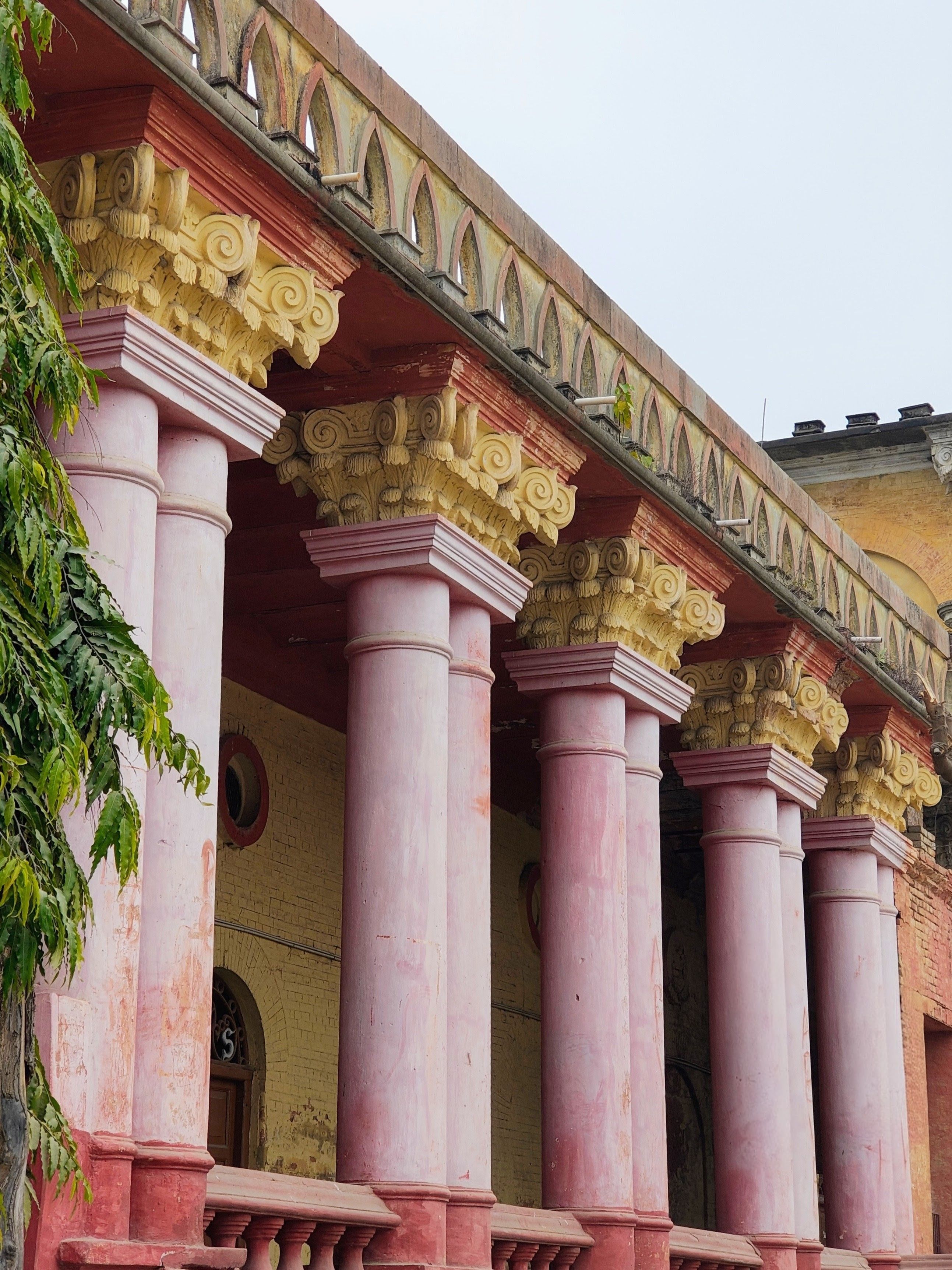 Ornate Pink Columns on Historic Building · Free Stock Photo