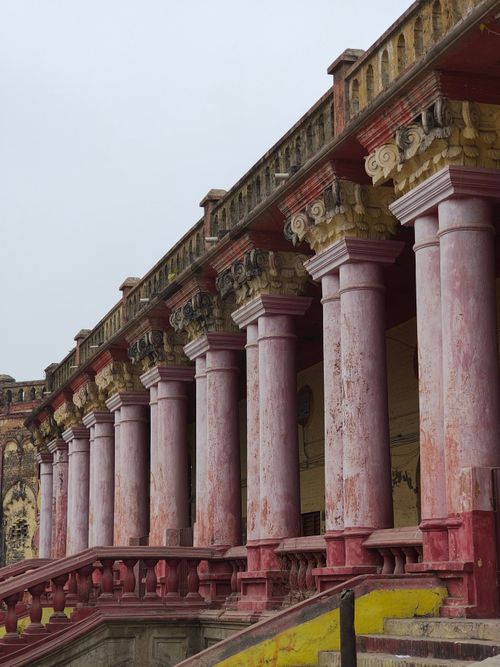 Free Elegant historic architecture featuring pink pillars and ornate details, creating a vintage ambiance. Stock Photo