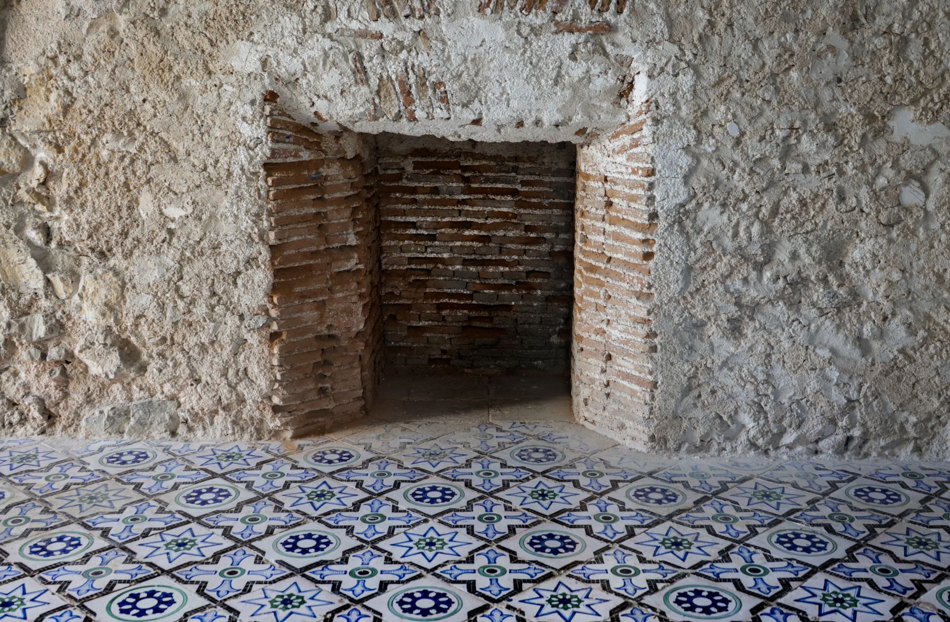 Mediterranean stone house interior with terracotta floor