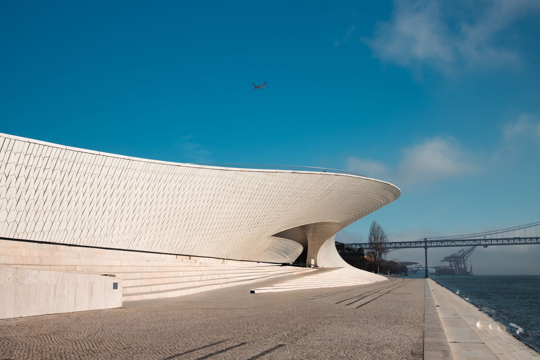 Explore the stunning curves of the MAAT Museum in Lisbon, Portugal.