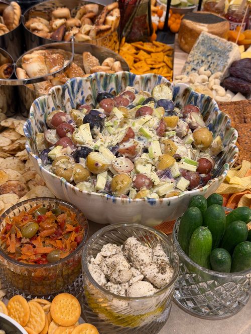 Free A vibrant spread featuring grape salad, cheese platter, cucumbers, and olives, perfect for gatherings. Stock Photo
