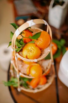 Vibrant oranges arranged in a bamboo basket adding a fresh touch.