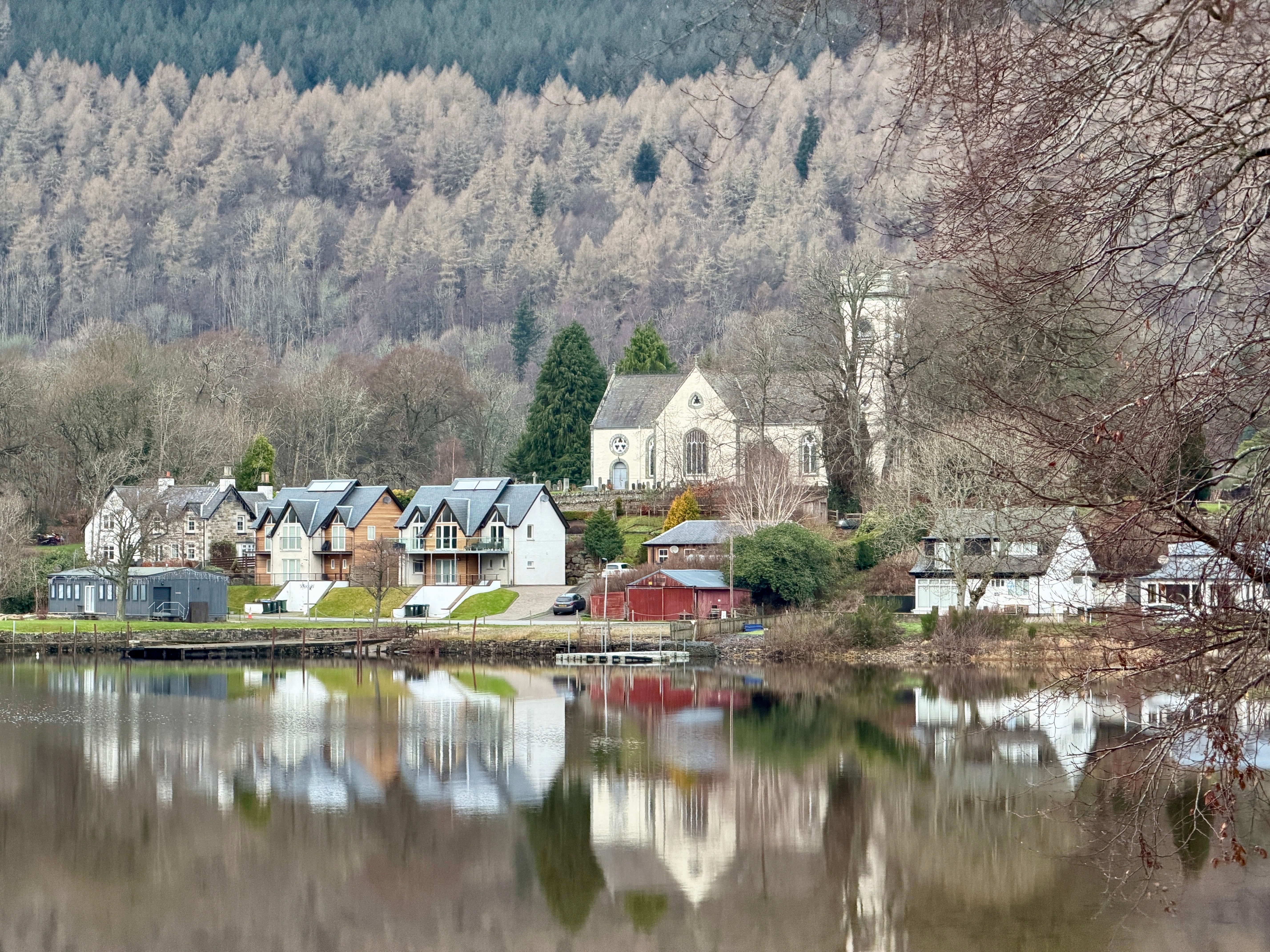 Idyllic Lakeside Village with Historic Church in Winter · Free Stock Photo