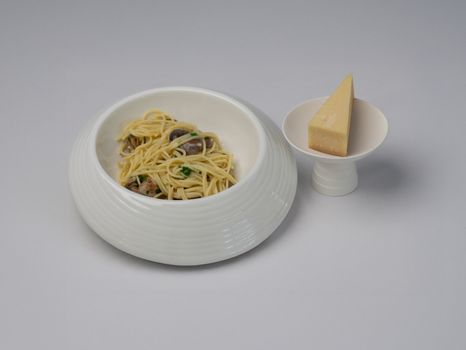 A minimalistic presentation of spaghetti and cheese in Bodrum, Turkiye, capturing culinary elegance.