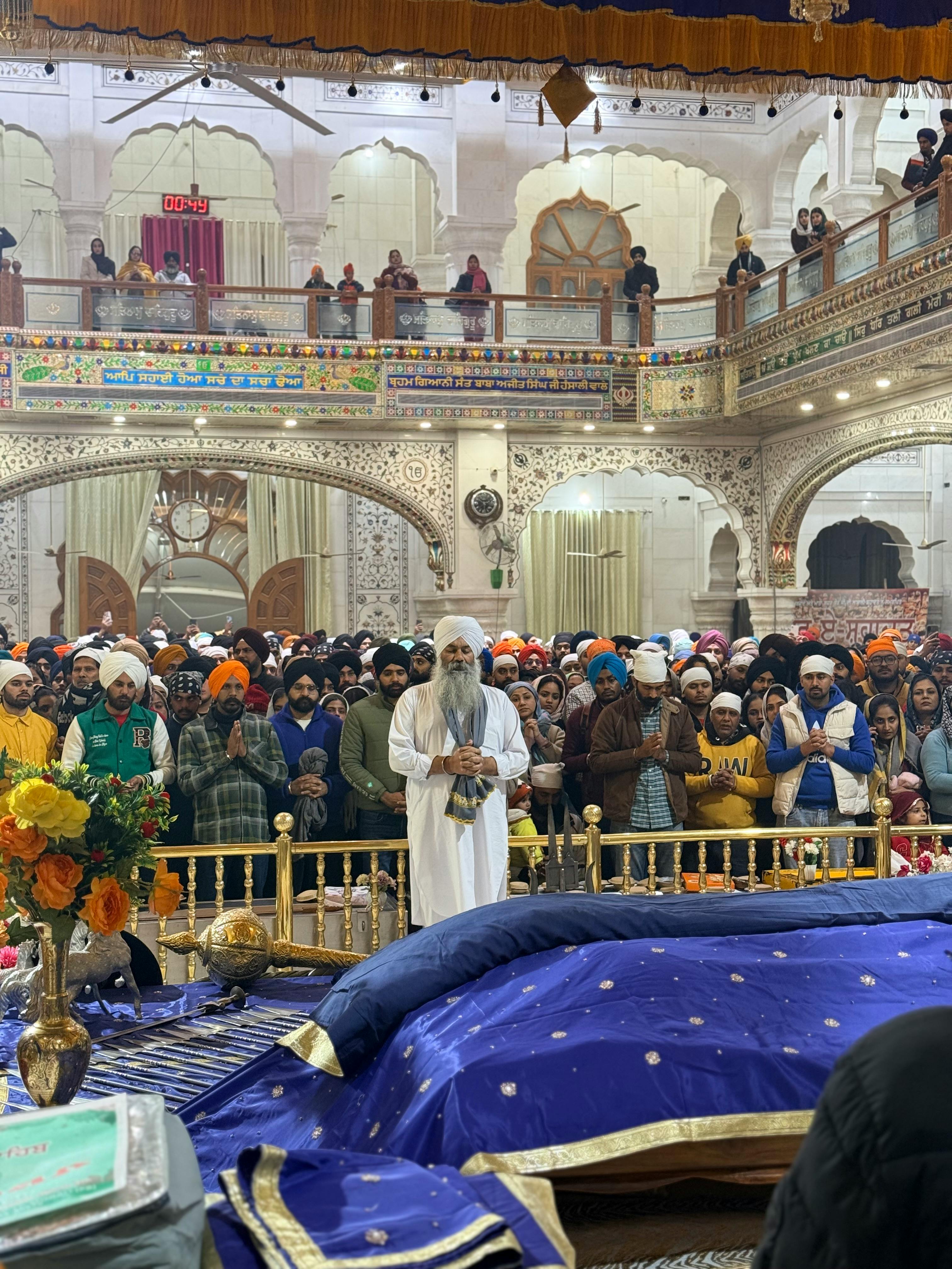 Devotees in prayer inside a Sikh gurdwara in Sahibzada Ajit Singh Nagar, India.