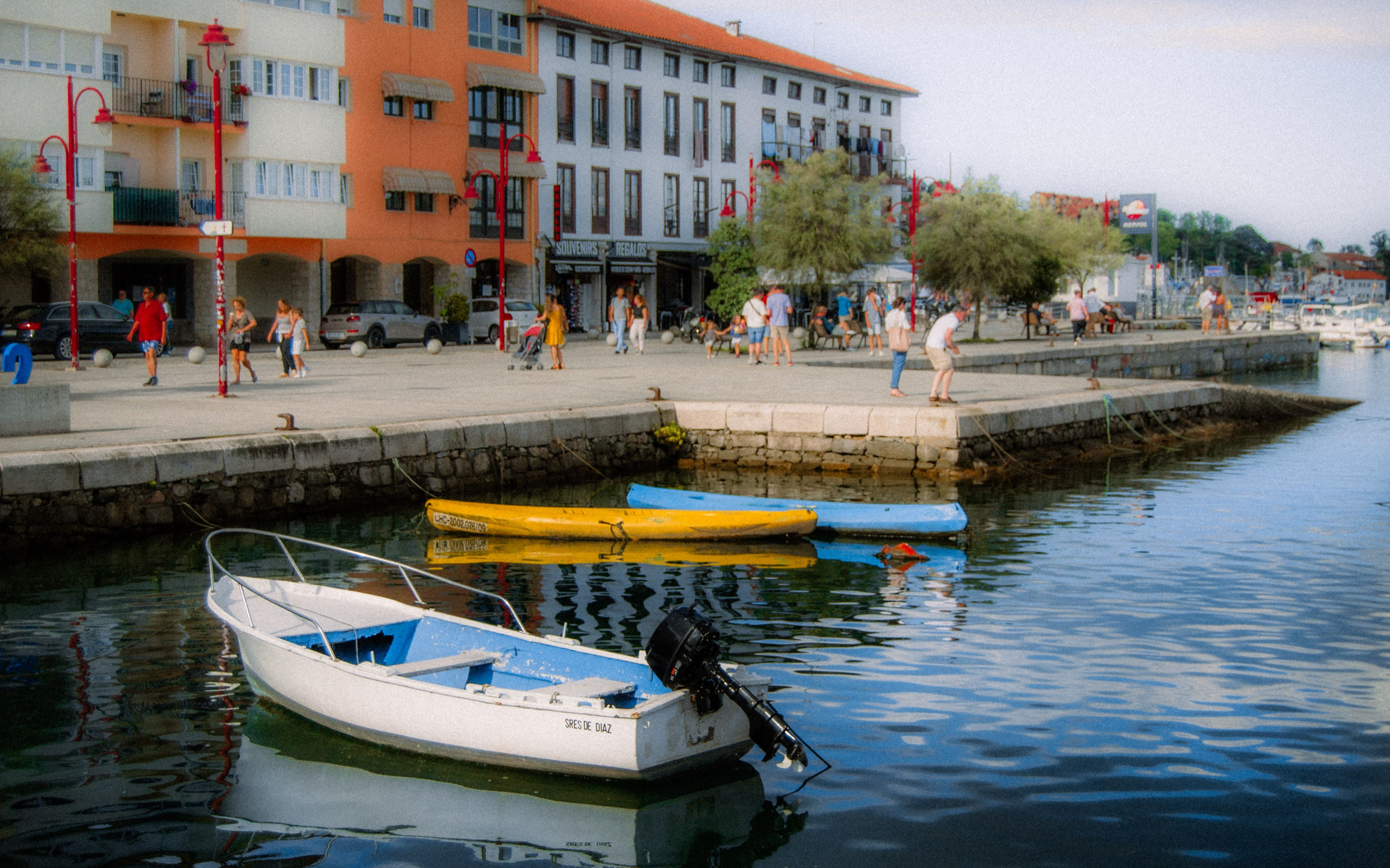 Idyllic seaside view with boats and colorful buildings in Asturias, Spain. - Asturias
