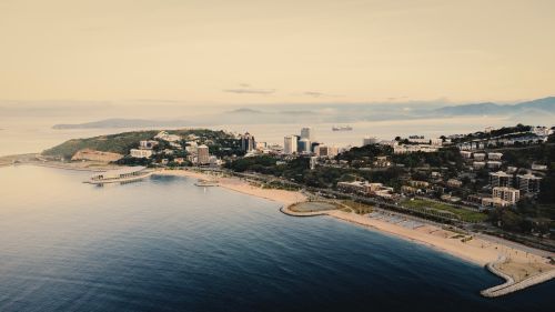Free Aerial view of Port Moresby with its scenic coastline and urban landscape at sunrise. Stock Photo