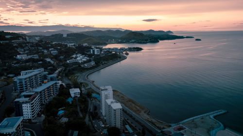 Free Stunning aerial view of Port Moresby, Papua New Guinea, at sunrise highlighting the coastline and urban landscape. Stock Photo