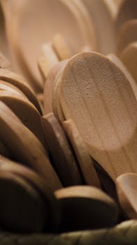 A detailed close-up view of wooden spoons showcasing natural texture and craftsmanship.
