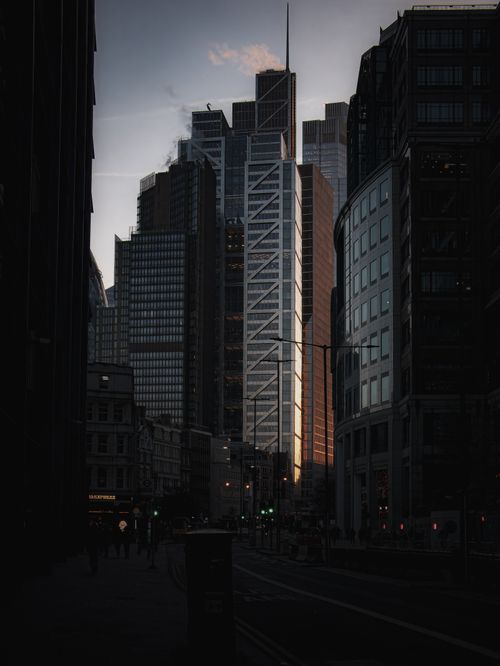 Free Majestic view of illuminated skyscrapers at dusk, depicting urban architecture and city life. Stock Photo