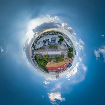 A captivating 360-degree aerial view of downtown Valladolid, featuring a mix of urban architecture and lush greenery.