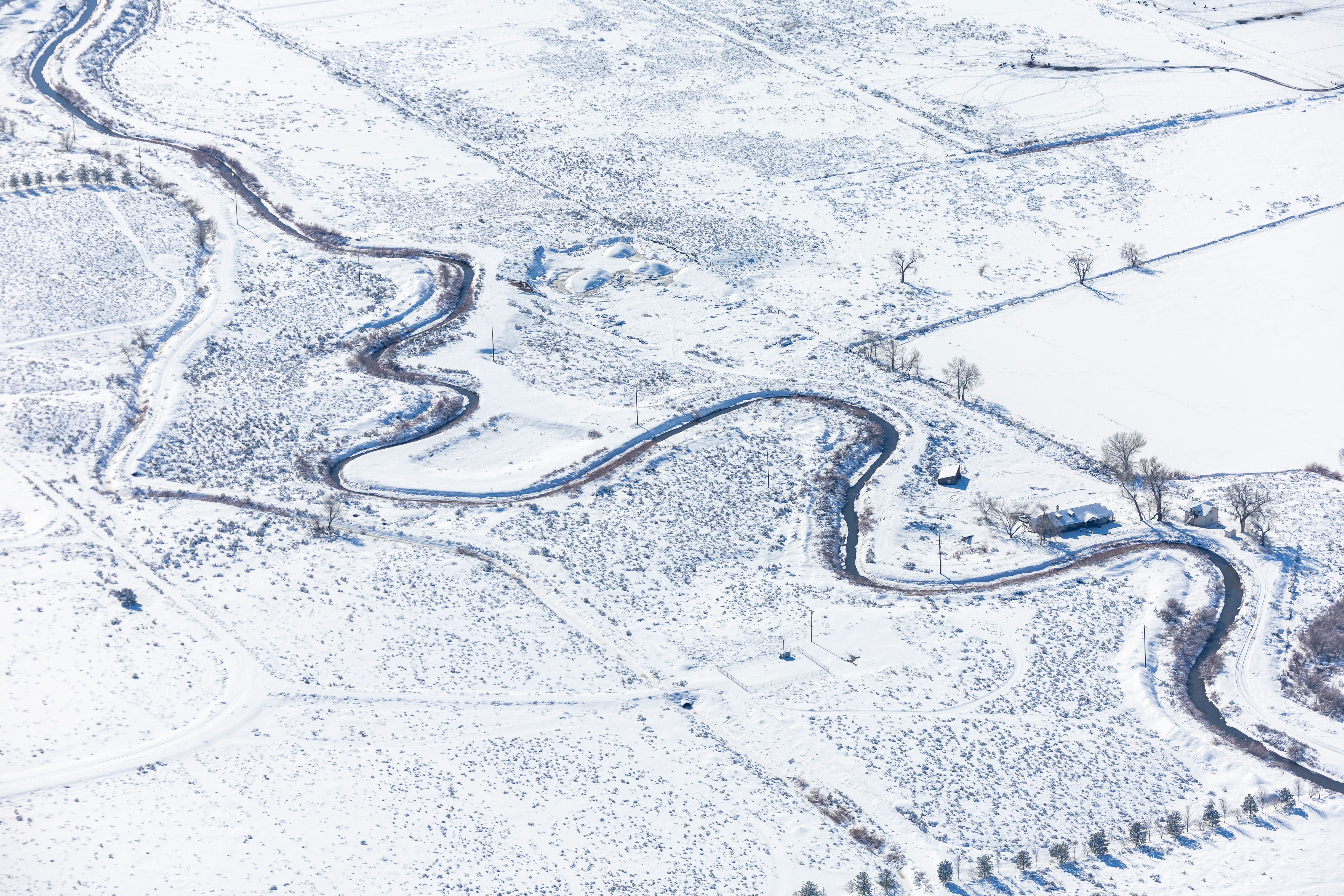 Aerial View of Snow Covered Rural Landscape in Winter · Free Stock Photo