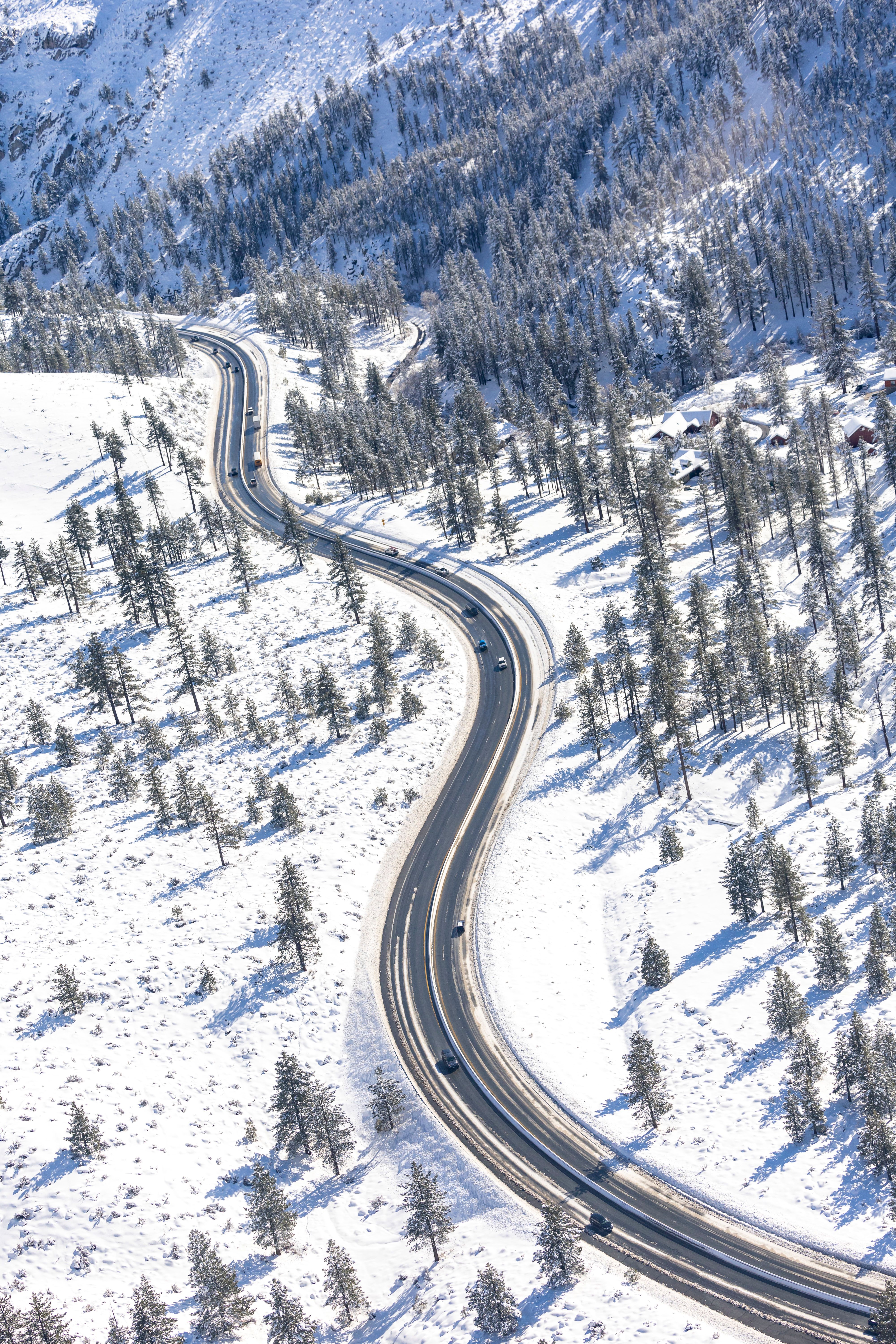 Aerial View of Snowy Mountain Road in Winter · Free Stock Photo