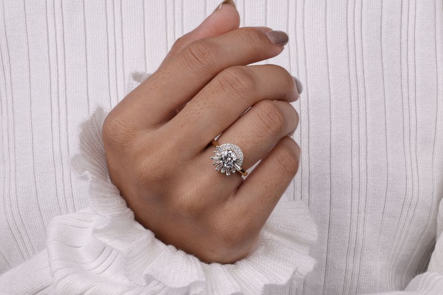 White gold diamond ring on hand, clean white background