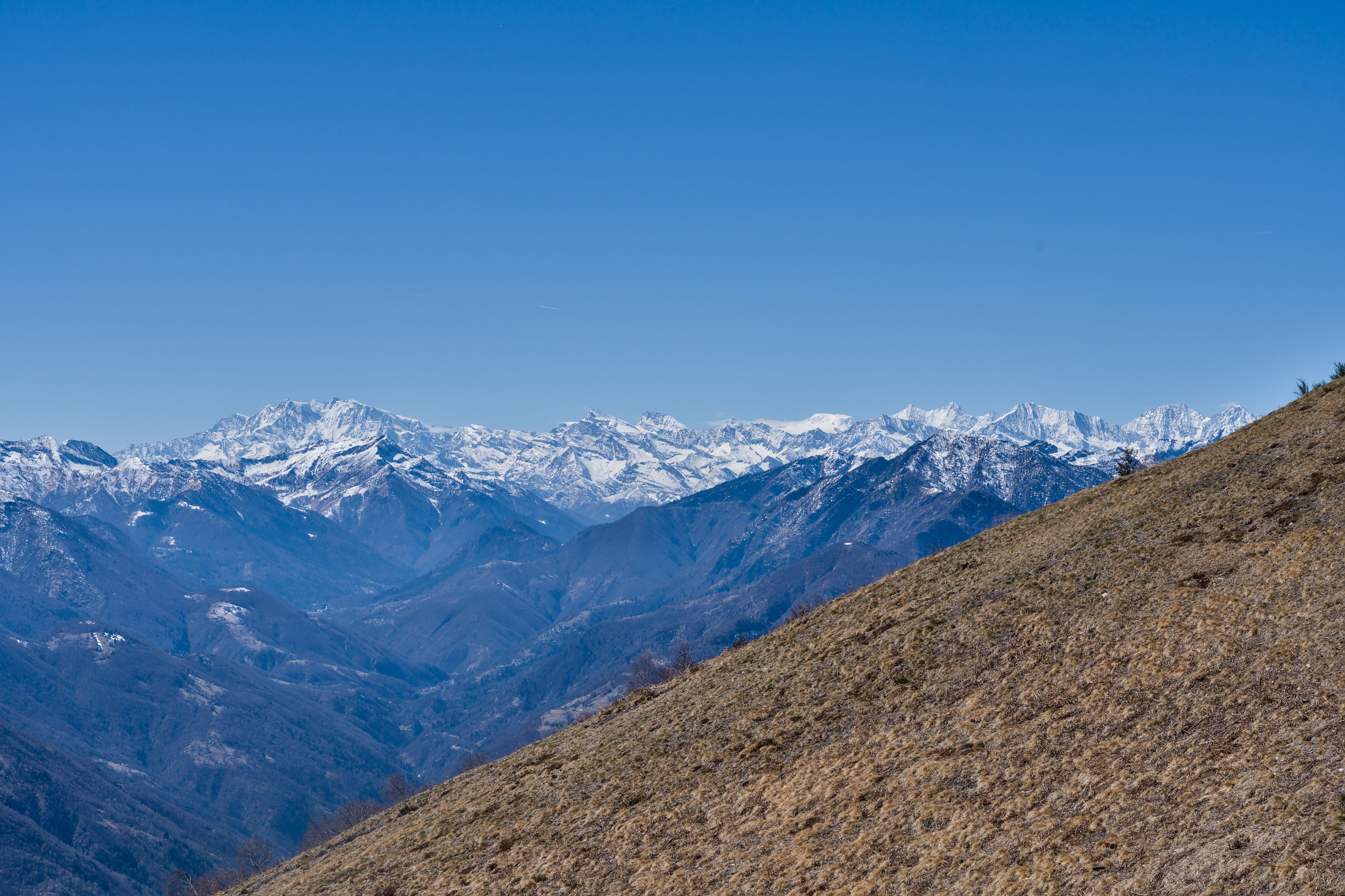 Snowy Alpine Mountains Under Clear Blue Sky · Free Stock Photo