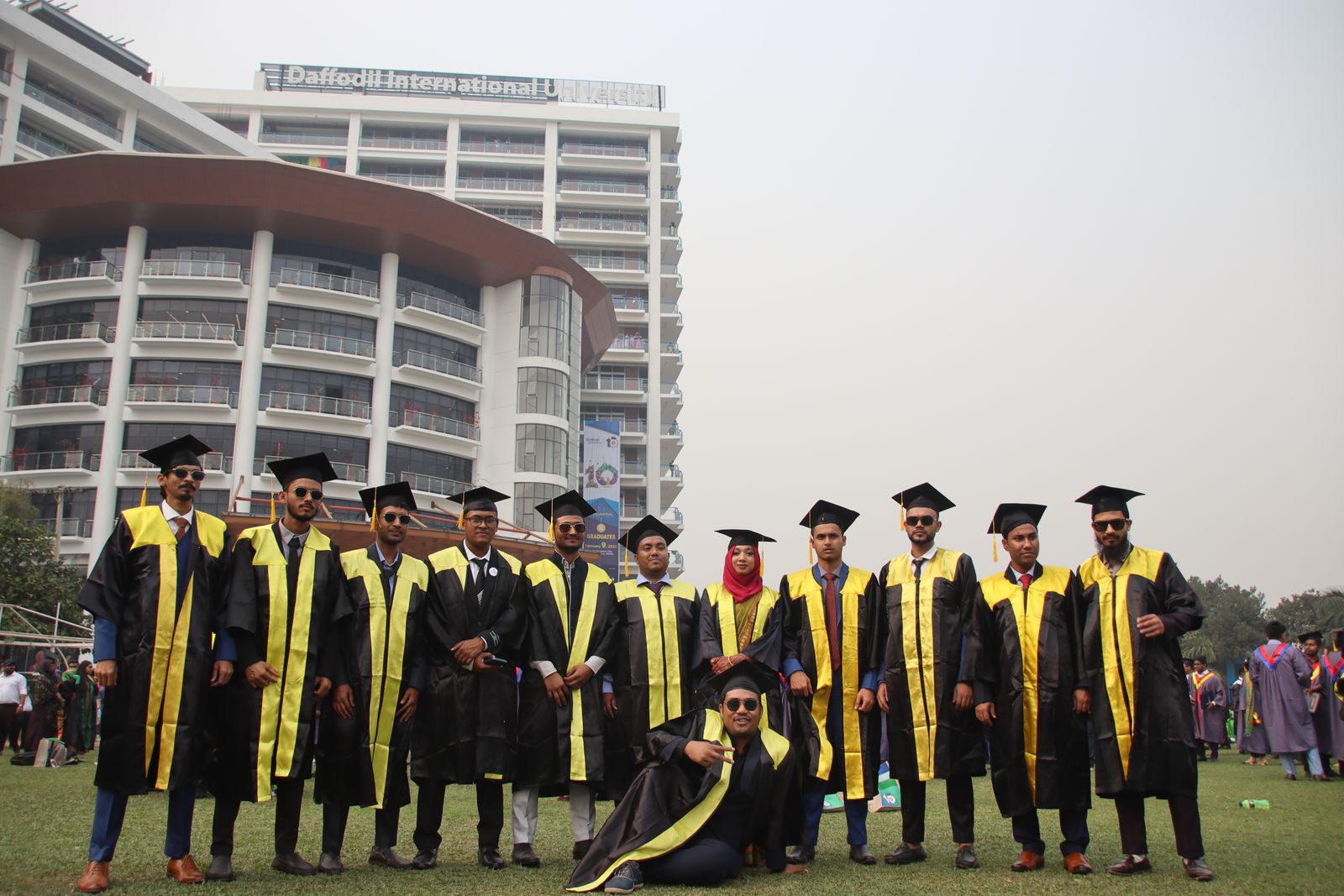 Graduating students celebrating on a university campus