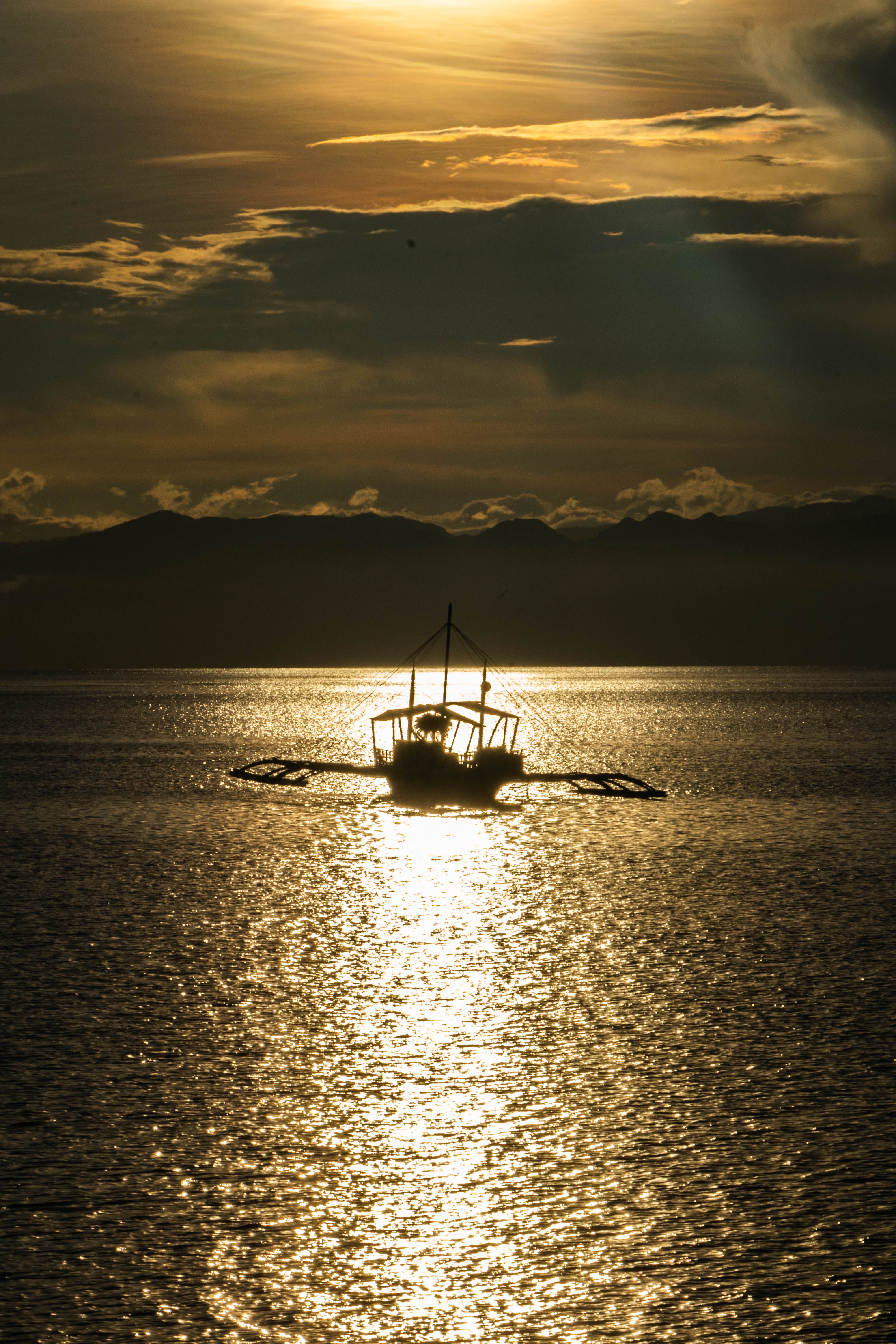 Silhouette of Boat on Sea during Sunset · Free Stock Photo