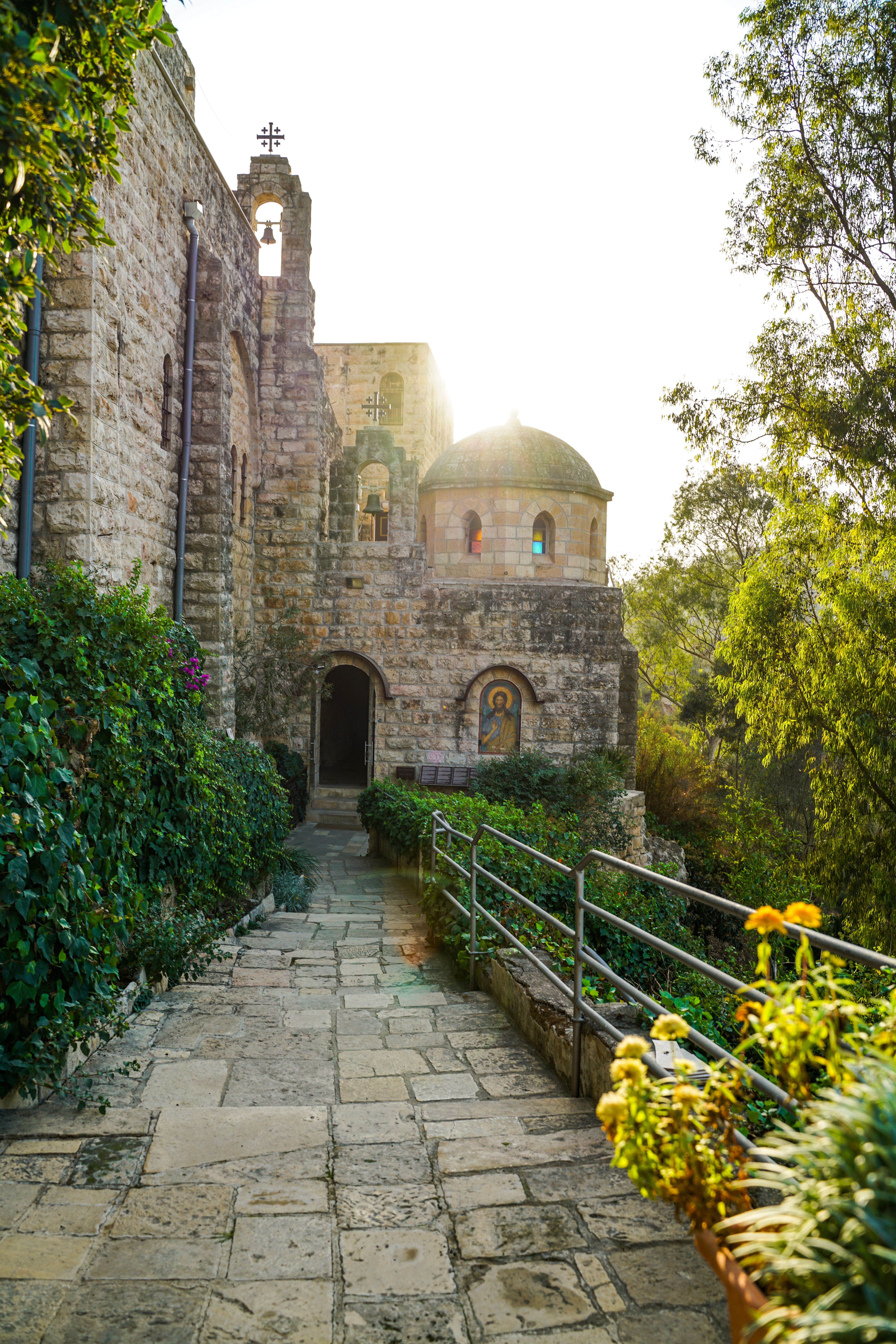 Sunlit Pathway to Historic Stone Monastery · Free Stock Photo
