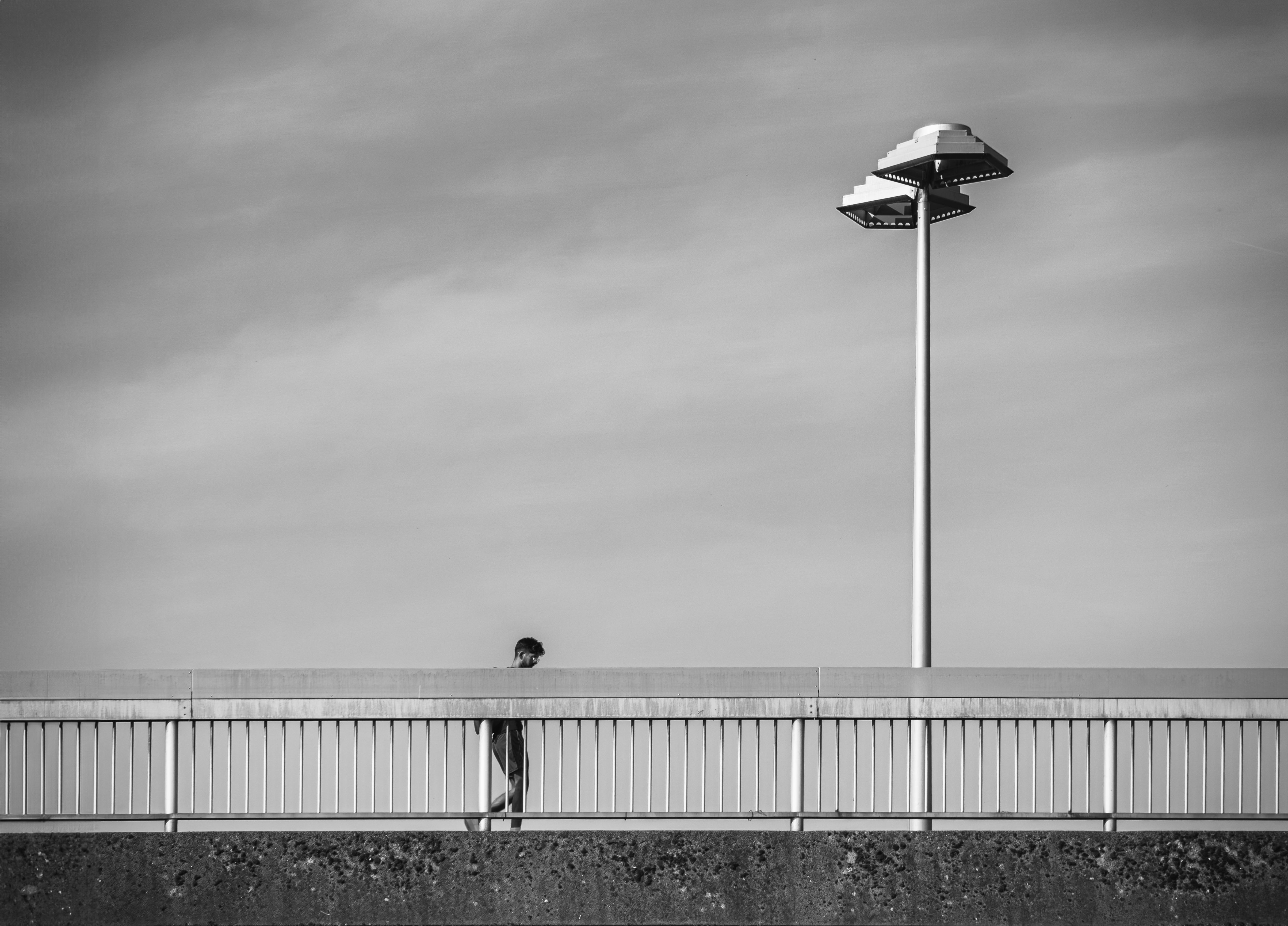 Black and White Urban Bridge Scene with Lamp · Free Stock Photo
