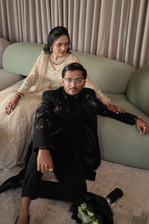 Free Sophisticated couple wearing formal Indian attire in an elegant indoor setting. Stock Photo